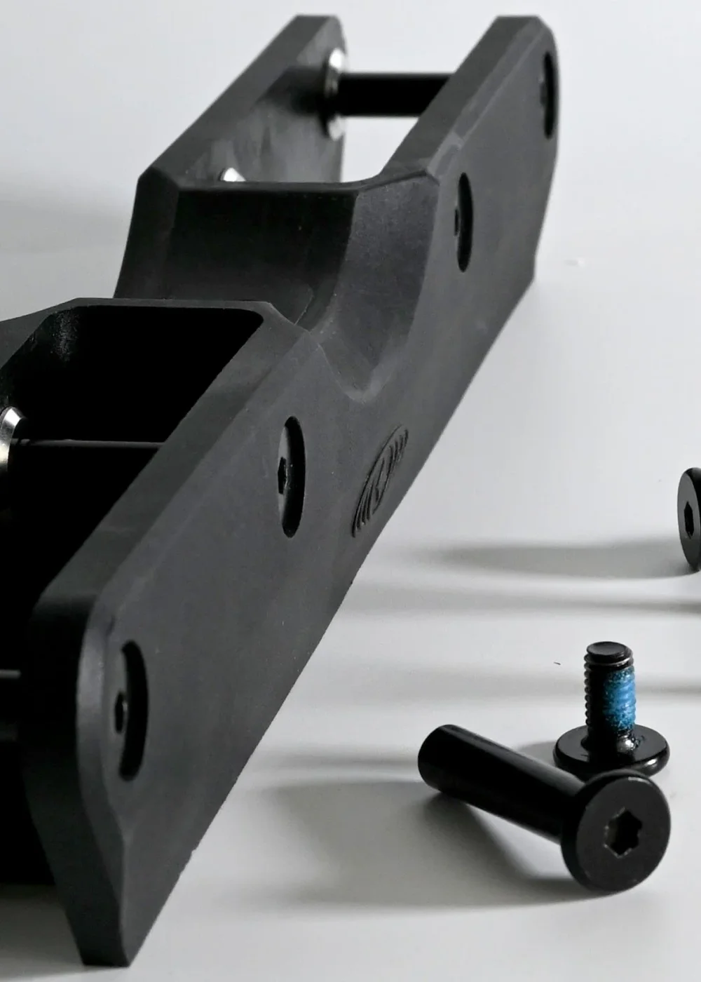 Close-up of the frame’s groove, mounting channel, and axle hardware