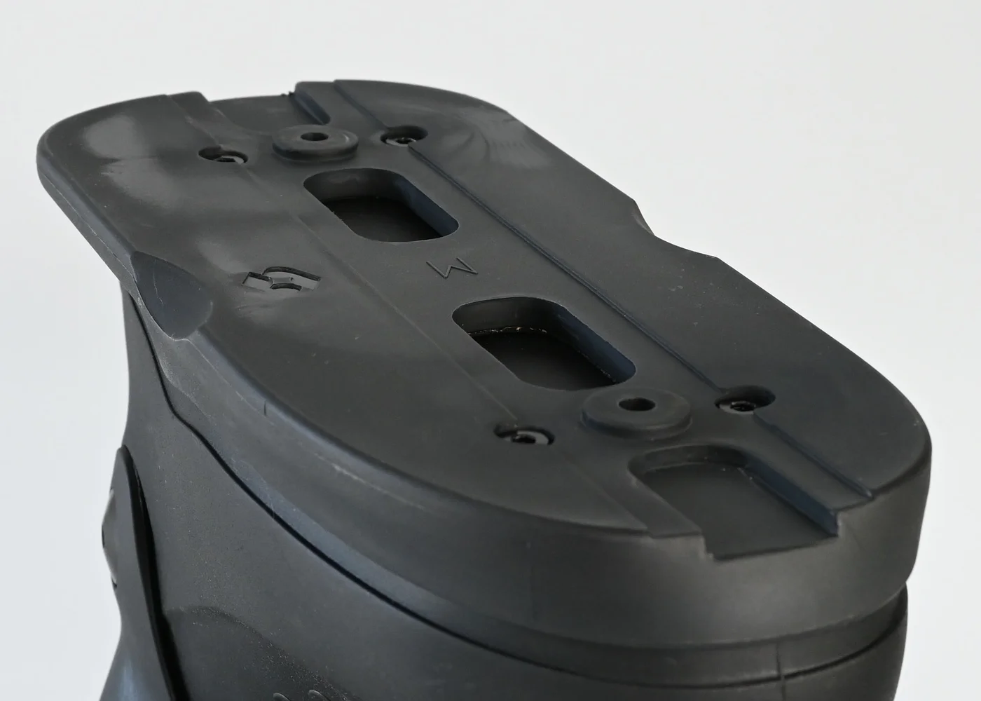 Close-up of the boot base, mounting channels, and recessed hardware
