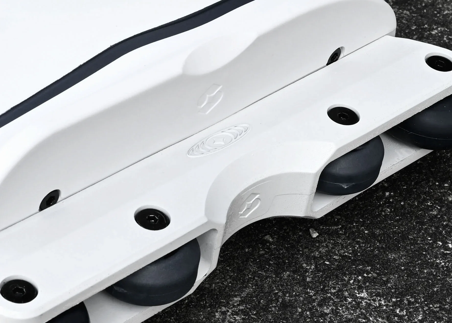 White Omni soul plate and antirocker frame with recessed black hardware